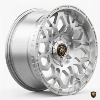 Silver alloy wheel with a modern hexagonal design, featuring a stylish black and gold center cap on a white background.