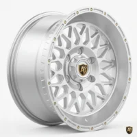 Stylish silver alloy wheel with intricate design and logo emblem, perfect for enhancing car aesthetics and performance.