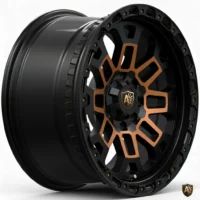 Black and bronze alloy wheel with intricate design and logo, perfect for enhancing vehicle aesthetics.
