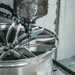 CNC-forged precision: AEGIS RIM wheels shaped for durability, balance, and uncompromising safety. AEGIS RIM forged wheel undergoing CNC machining—precision engineering for strength, balance, and safety.