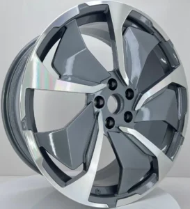 Sleek silver and gray alloy wheel showcasing a modern, sporty design, perfect for enhancing vehicle aesthetics.