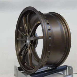 Stylish bronze alloy wheel showcasing modern design and precision engineering, ideal for performance vehicles.