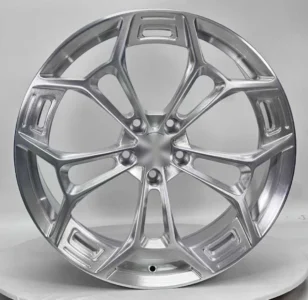 Close-up of a modern, silver alloy wheel showcasing a sleek design and intricate detailing for automotive enthusiasts.