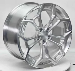Stylish silver alloy wheel showcasing a modern design, perfect for enhancing vehicle appearance and performance.