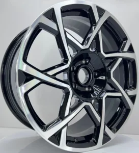 Sleek black and chrome alloy wheel with a modern geometric design, ideal for enhancing vehicle aesthetics.